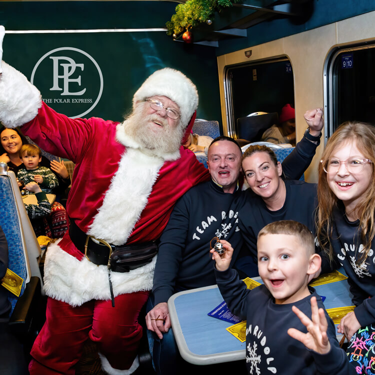 santa with family on board the polar express train ride