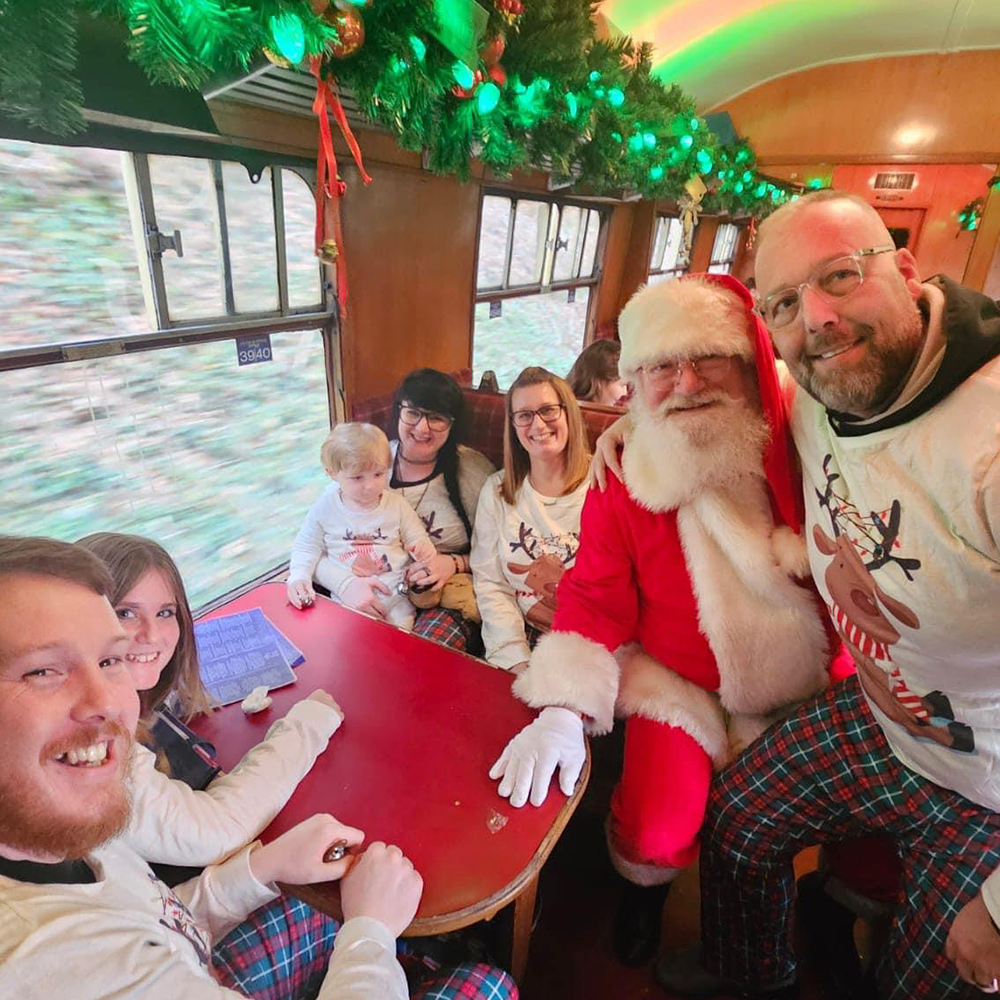 Santa visiting guests on board The Polar Express Train Ride South Devon 