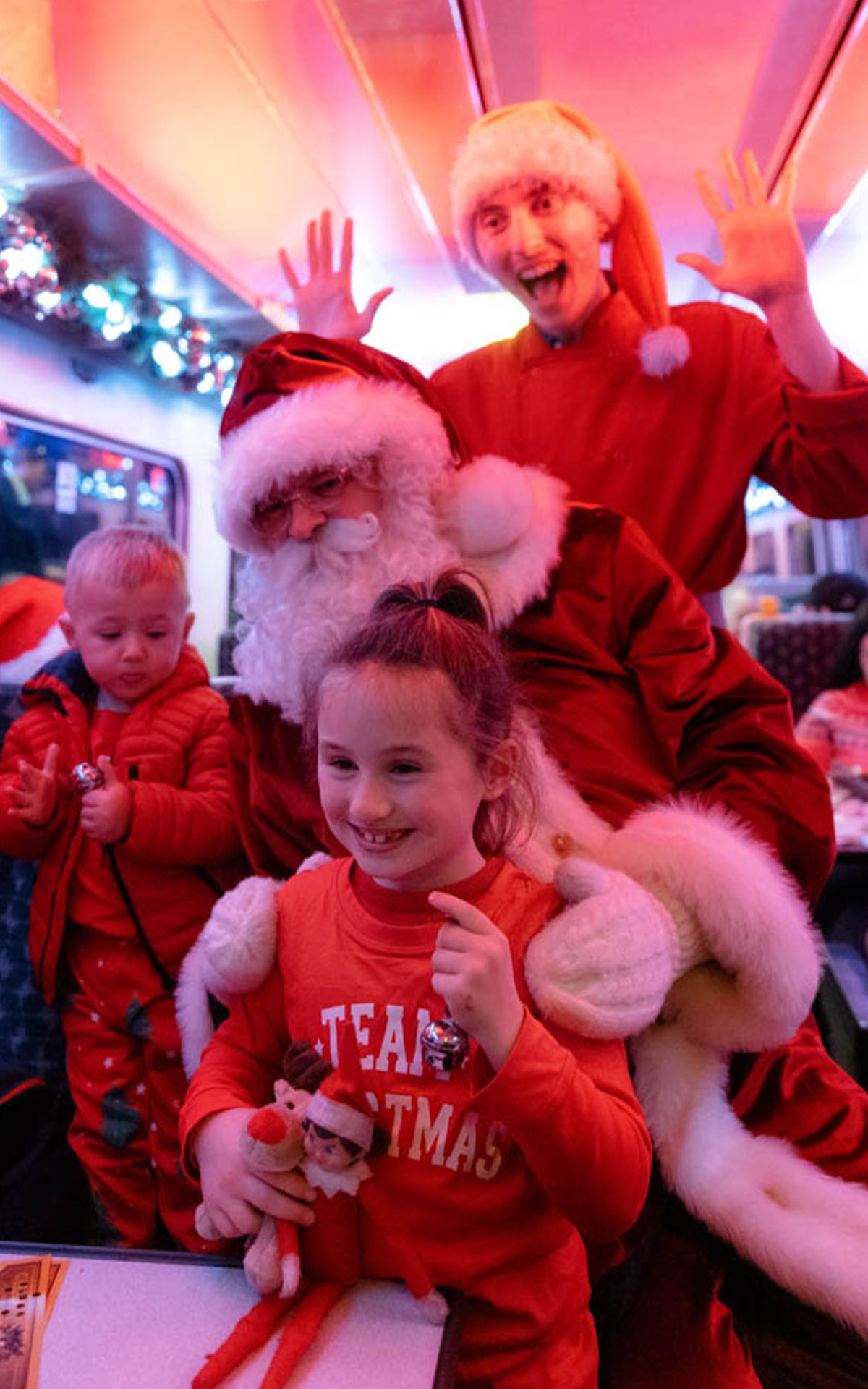 santa with family on board the polar express train ride