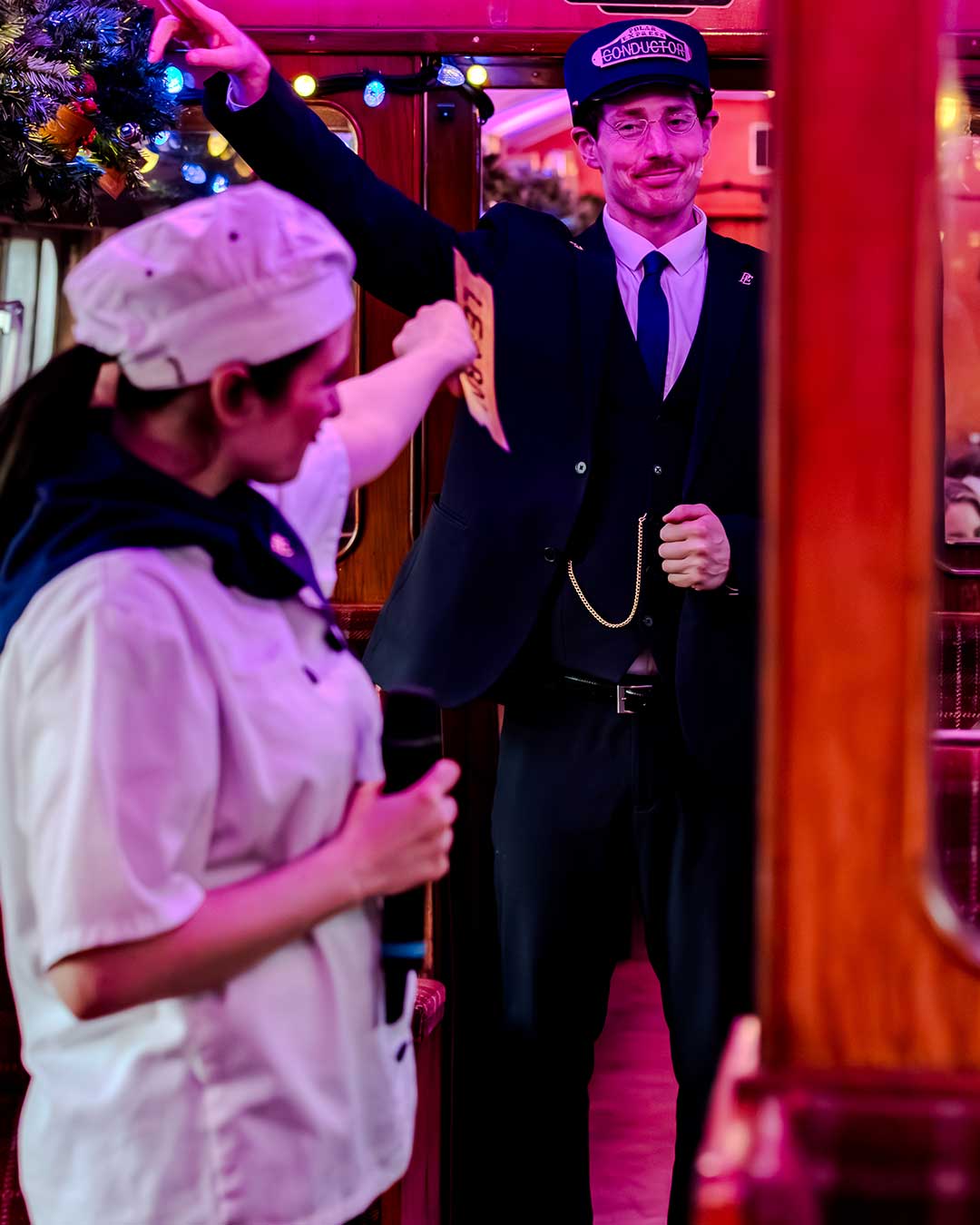 chef and conductor on board the polar express train ride