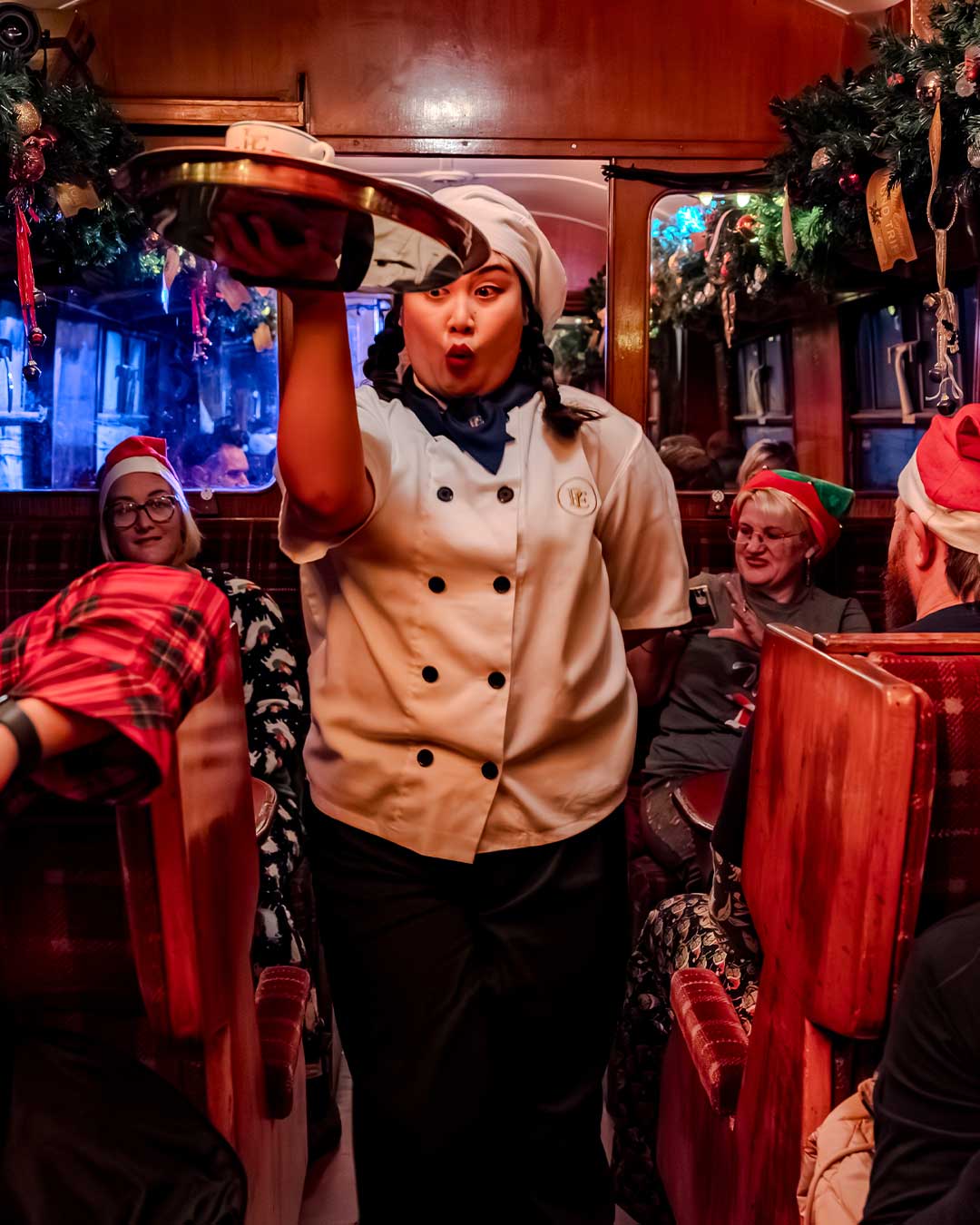 chef serving hot chocolate on the polar express train ride