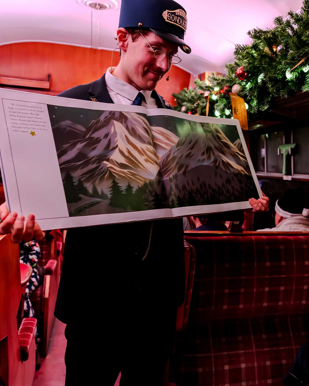 conductor with book on board the polar express train ride